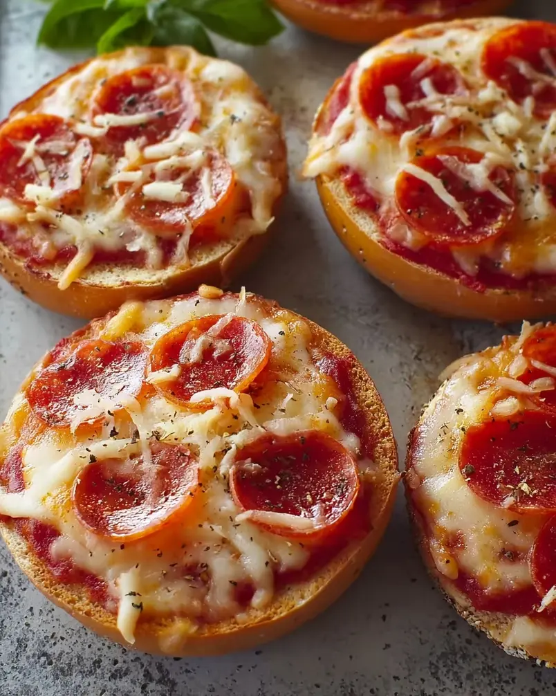 Easy Mini Bagel Pizzas 2 Preparing easy mini bagel pizzas with ingredients laid out